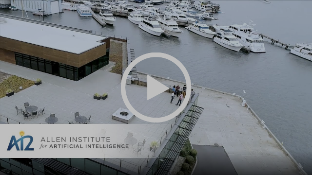 Video thumbnail of office building near water with boats