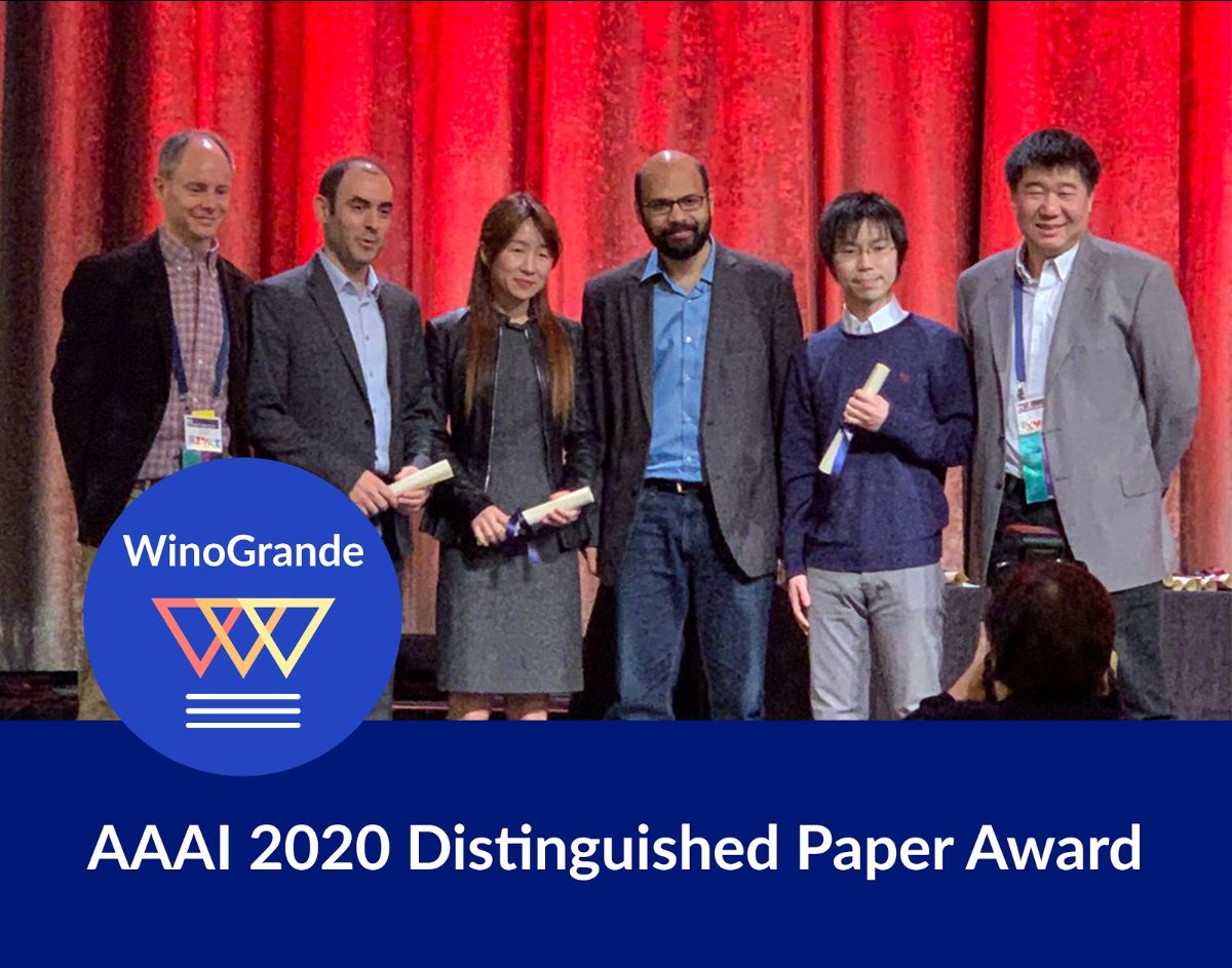 A group of people receiving the AAAI 2020 Distinguished Paper Award
