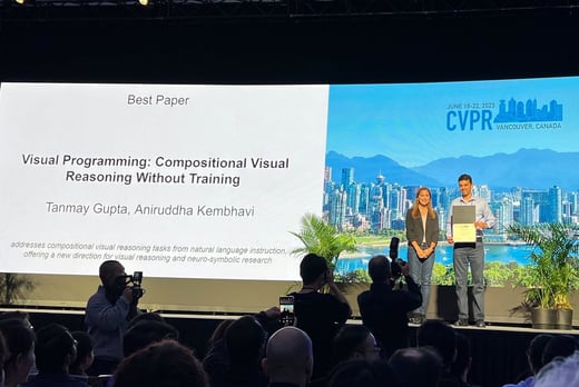 A photograph of Ani Kembhavi being awarded the Best Paper Award for VisProg at CVPR 2023.