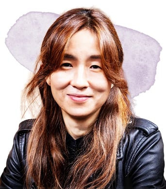 A photograph of Yejin Choi, a woman with long brown hair wearing a leather jacket.